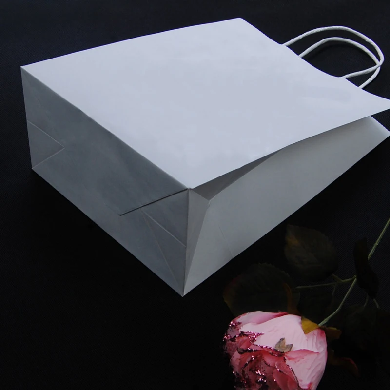 

27*21*11cm 30PCS/lot white color paper gift bag Festival Paper bag with handles Fashionable cloth bags Excellent Quality