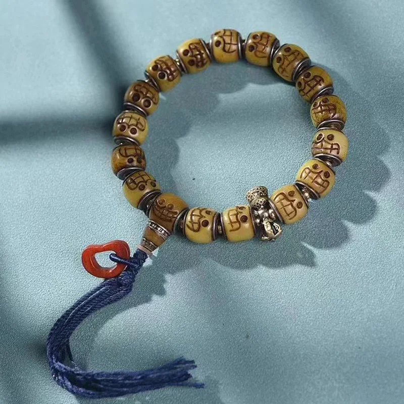 

Camel Bone Three-Ring Hole Inlaid Old Copper Diamond Bell Tibetan-Style Adai Buddha Head Bracelet