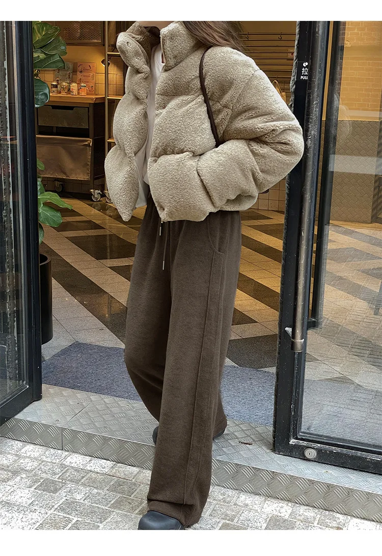 Autumn and winter women's casual solid color standing collar long sleeved loose down jacket
Autumn and winter women's casual solid color standing collar long sleeved loose down jacket