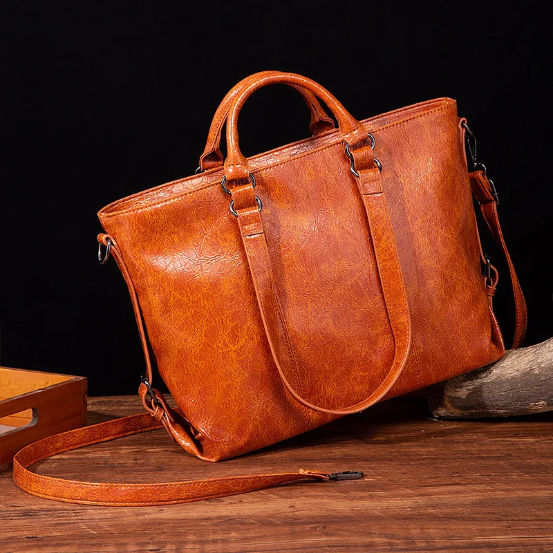 Europe and the United States retro fashion wax soft leather A4 computer large capacity Tote shoulder handbag
Europe and the United States retro fashion wax soft leather A4 computer large capacity Tote shoulder handbag