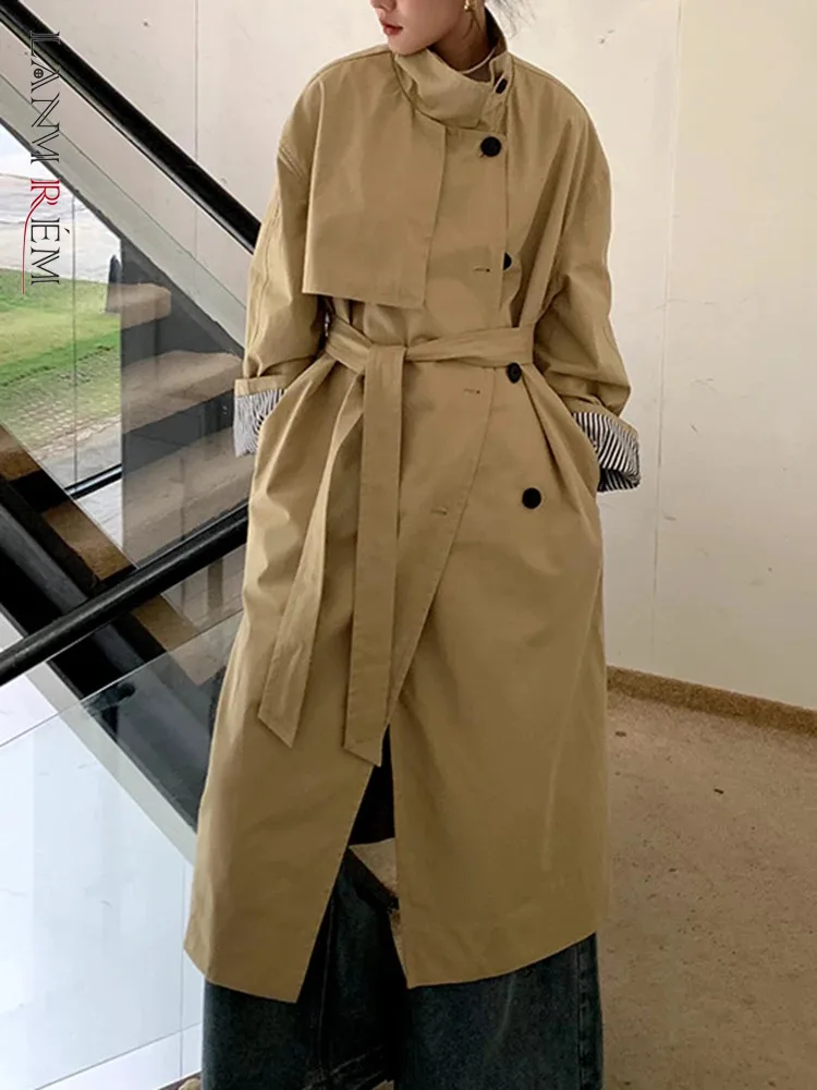 

[LANMREM] Irregular Spliced Long Trench For Women Stand Neck Single Breasted Office Lady Windbreak 2024 Spring New 26D7897