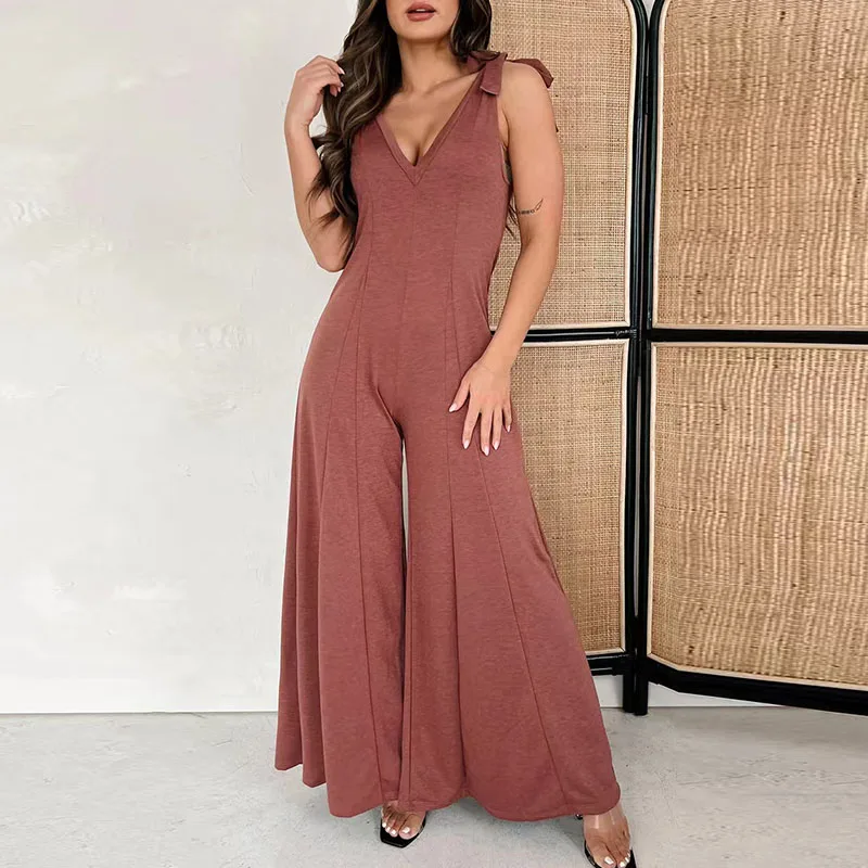 

Sexy Solid Color Deep V Neck Jumpsuit New Women High Street One Piece Bodysuit Sexy Slim Sleeveless Bow Strap Flare Pant Overall