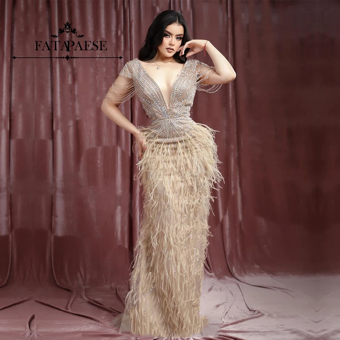 

FATAPAESE Prom Dress Cap Sleeves with Beading Sparking Stones Bodice Swag Tassels and Plunging V Neck Feather Skirt Formal Gown