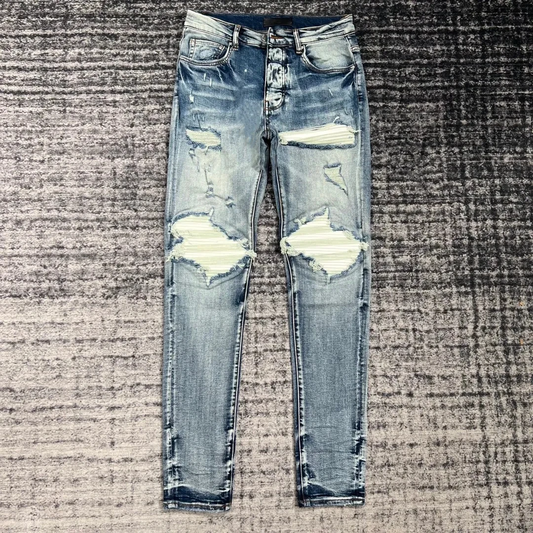 New arrival men's high street blue ripped jeans with white patch wash water holes splicing white leather patch slim jeans men
New arrival men's high street blue ripped jeans with white patch wash water holes splicing white leather patch slim jeans men