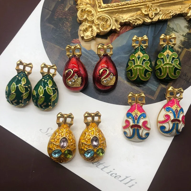 Middle ancient colored enamel glaze gilded swan shaped colored egg earrings
Middle ancient colored enamel glaze gilded swan shaped colored egg earrings