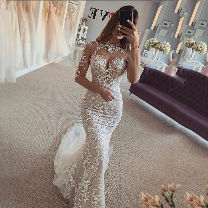 Lace Mermaid Wedding Dresses with Illusion Long Sleeve High Neck Beaded Appliqued Backless Bridal Gowns 2023
Lace Mermaid Wedding Dresses with Illusion Long Sleeve High Neck Beaded Appliqued Backless Bridal Gowns 2023