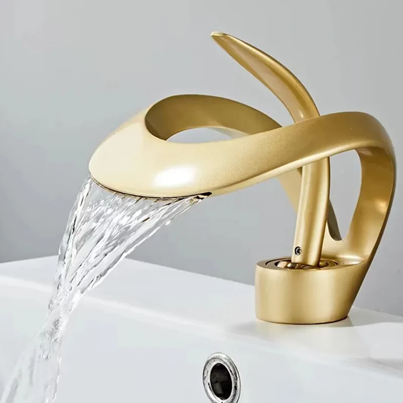

Art deck installed hot and cold faucets brass brushed gold bathroom mixer faucet waterfall basin sink faucet.