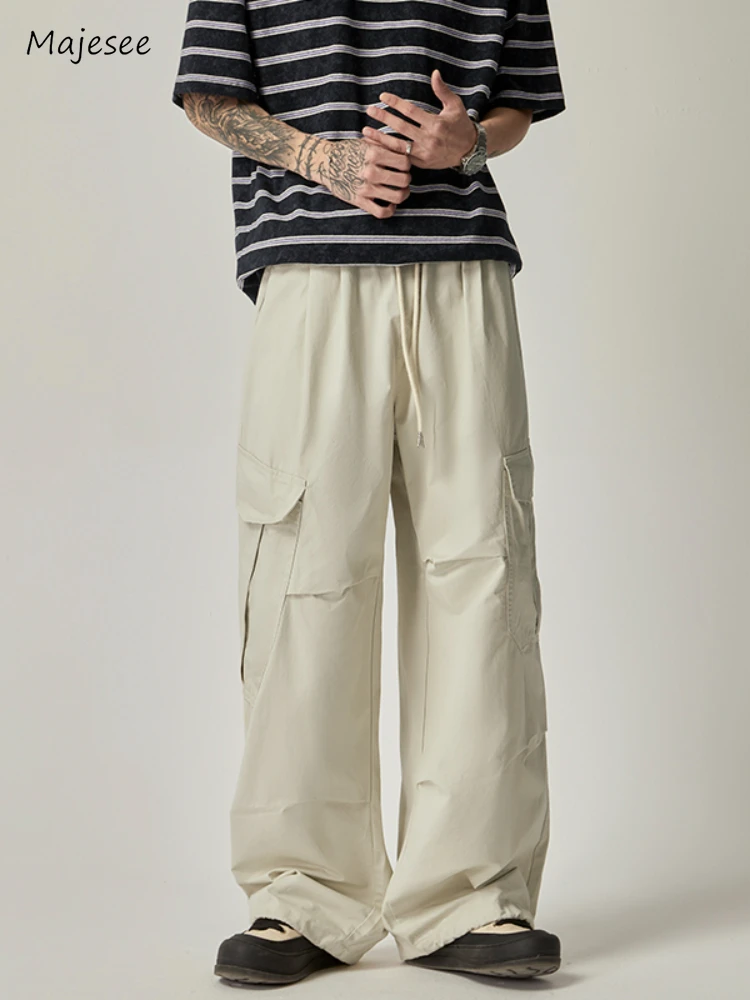 

Брюки-карго мужские повседневные, свободные универсальные штаны в стиле ретро, с эластичным поясом, Универсальные однотонные модные штаны в американском стиле с несколькими карманами, весна-осень