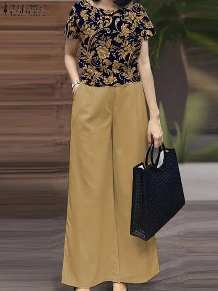 Женский модный Дизайнерский Костюм ZANZEA, блузка с коротким рукавом и круглым вырезом и широкие брюки, элегантные комплекты из 2 предметов с цветочным принтом, большие размеры
Женский модный Дизайнерский Костюм ZANZEA, блузка с коротким рукавом и круглым вырезом и широкие брюки, элегантные комплекты из 2 предметов с цветочным принтом, большие размеры