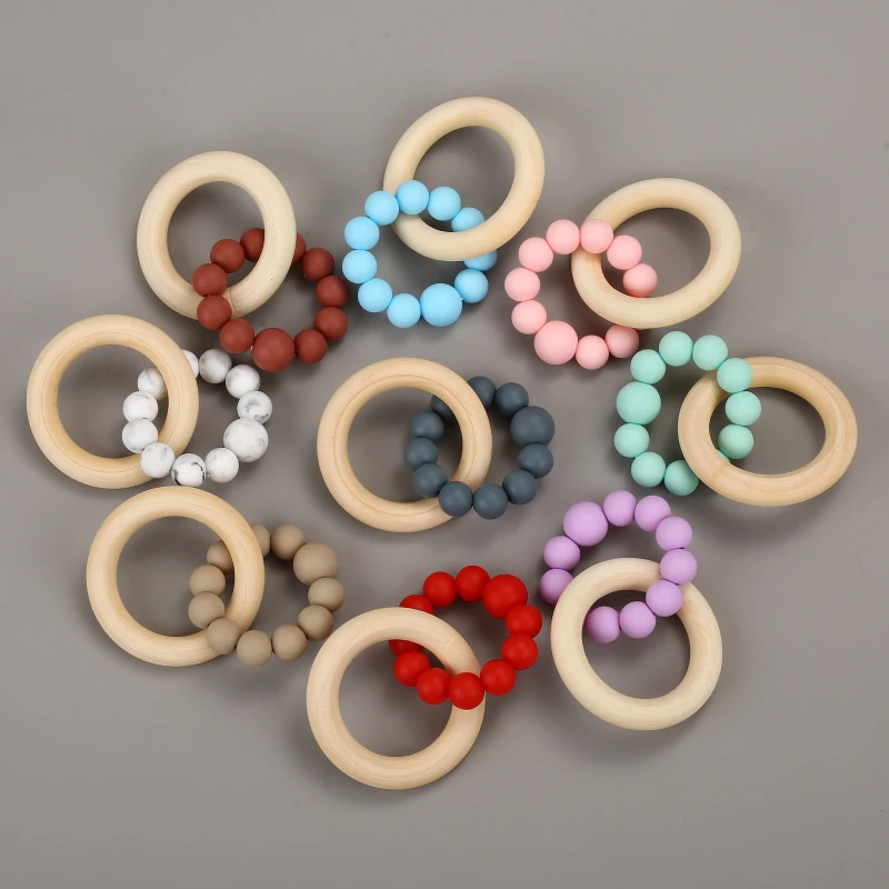 Food Grade Baby Silicone Round Beaded Bracelet Wooden Teether Ring Rattle Toys For Baby Nursing Teething Grasping Toys Gift
Food Grade Baby Silicone Round Beaded Bracelet Wooden Teether Ring Rattle Toys For Baby Nursing Teething Grasping Toys Gift