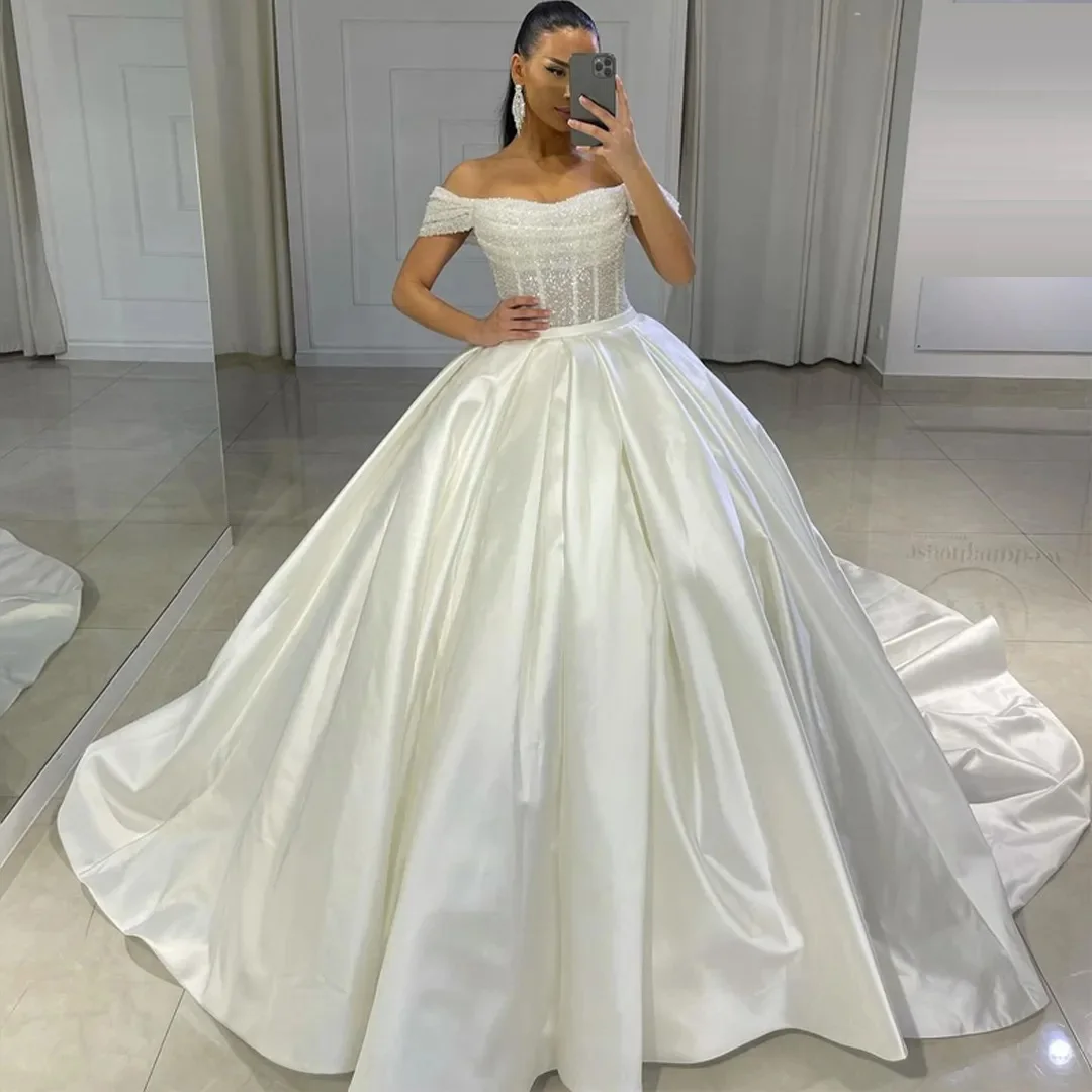 Stunning Bead Off the Shoulder Ball Gown Wedding Dresses Sequin Satin Princess Bridal Gown Pleat Plus Size Arabic Dubai Wedding
Stunning Bead Off the Shoulder Ball Gown Wedding Dresses Sequin Satin Princess Bridal Gown Pleat Plus Size Arabic Dubai Wedding