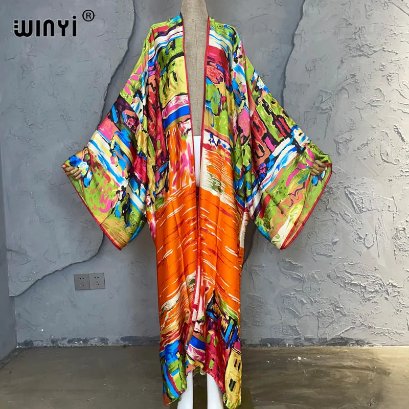 Женская Пляжная накидка в стиле бохо WINYI, Свободный кардиган с длинным рукавом и принтом граффити, уличное кимоно, Новинка лета 2023
Женская Пляжная накидка в стиле бохо WINYI, Свободный кардиган с длинным рукавом и принтом граффити, уличное кимоно, Новинка лета 2023