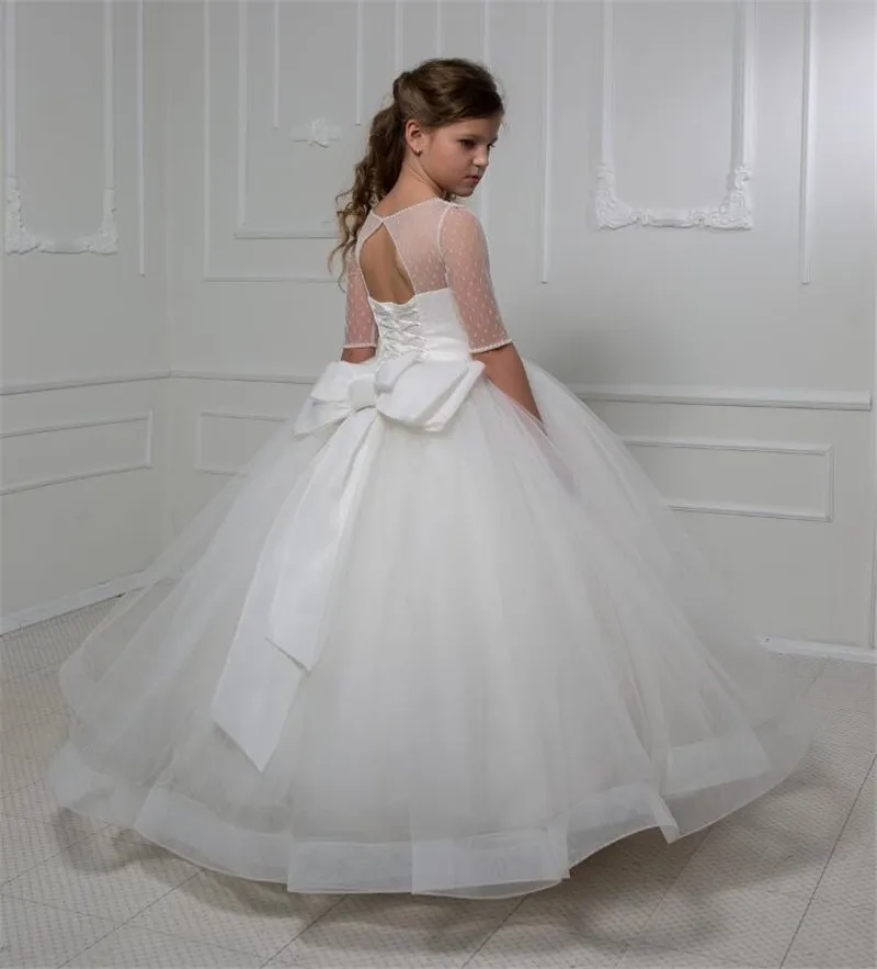 White Ivory Flower Girl Dresses for Wedding Sheer Neck Half Sleeves Big Ribbon Kid Princess Dress First Communion Gown
White Ivory Flower Girl Dresses for Wedding Sheer Neck Half Sleeves Big Ribbon Kid Princess Dress First Communion Gown
