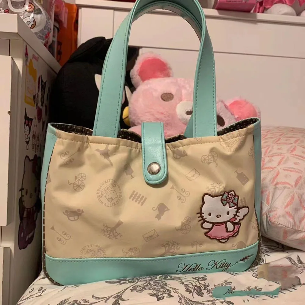 New Hello Kitty Cartoon Tote Bag Commuter Large Capacity Bag Portable Shoulder Bag Anime Figure Cute Student Girl Handheld Bag
New Hello Kitty Cartoon Tote Bag Commuter Large Capacity Bag Portable Shoulder Bag Anime Figure Cute Student Girl Handheld Bag