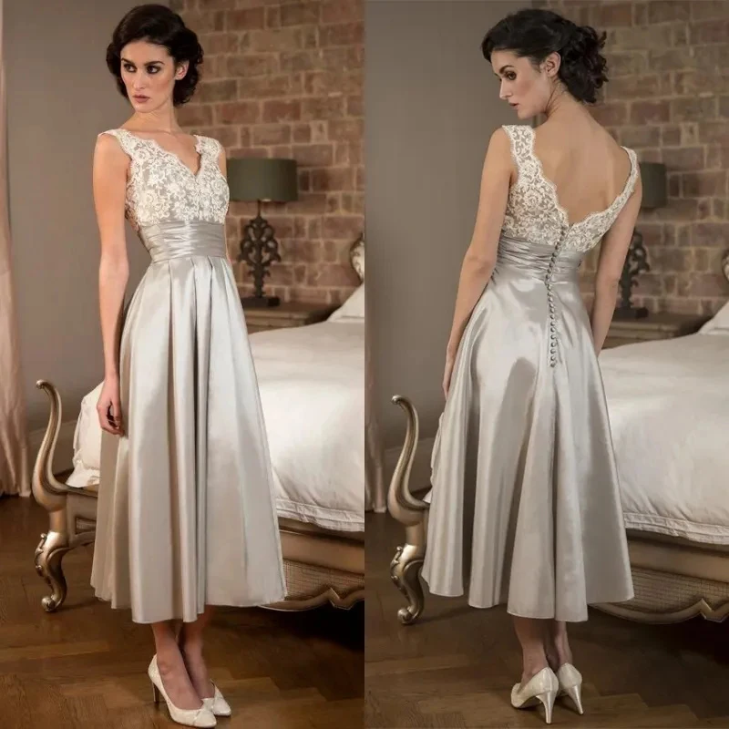 Sexy Tea Length Short V Neck Backless Sleeveless Lace Mother of the Bride Dresses For Weddings فساتين السهرة 2023
Sexy Tea Length Short V Neck Backless Sleeveless Lace Mother of the Bride Dresses For Weddings فساتين السهرة 2023