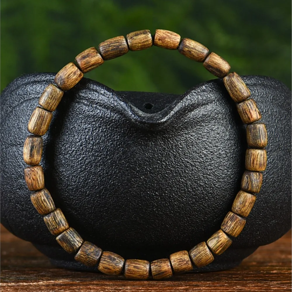 

Chinese Fragrance Hainan Qi Nan Agarwood Bracelet about 5mm Men's and Women's Matching Drum Beads Wenwan Wooden Bracelet
