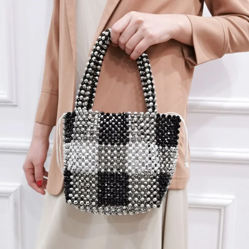 Retro Woven Versatile Women's Bag New Fashion Black Silver White Spliced Handmade Beaded Hollow Out Ladies Handbag Customization
Retro Woven Versatile Women's Bag New Fashion Black Silver White Spliced Handmade Beaded Hollow Out Ladies Handbag Customization