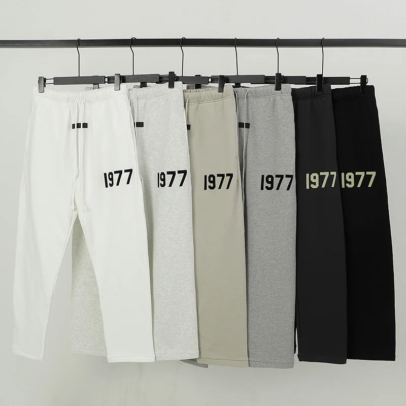 ESSENTIALS Pants Men Autumn Winter Sweatpants High Quality 100% Cotton Trousers 1977 Flocking Number Printing Hip Hop Streetwear
ESSENTIALS Pants Men Autumn Winter Sweatpants High Quality 100% Cotton Trousers 1977 Flocking Number Printing Hip Hop Streetwear