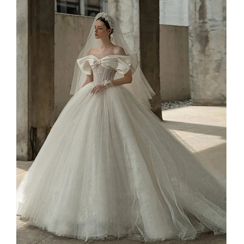 2024 Off The Shoulder Sweetheart Neck Shiny Beading Pearls Bow Tulle Lace Bow Ball Gown Wedding Dresses With 100cm Chapel Train
2024 Off The Shoulder Sweetheart Neck Shiny Beading Pearls Bow Tulle Lace Bow Ball Gown Wedding Dresses With 100cm Chapel Train