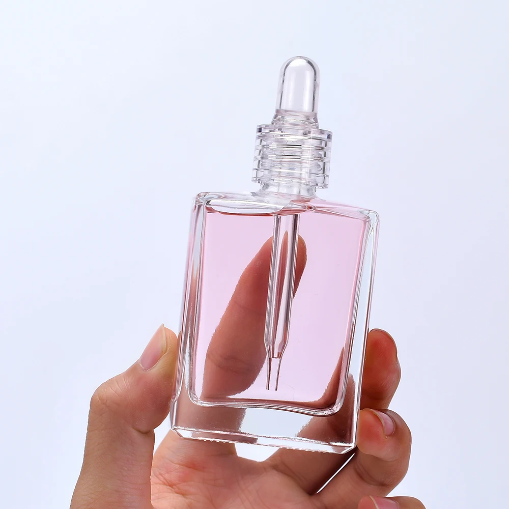 

New Trends Wholesale 15ml 30ml 50ml 100ml Cosmetic Package Square Shape Clear serum essential oil Glass Dropper Bottle