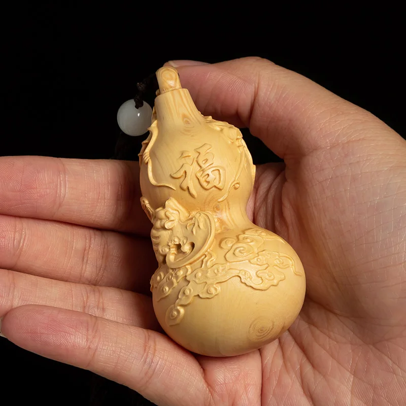 

Boxwood play hand piece men's portable disc toy piece handicraft pendant piece carved wood decoration piece Fu Lu Shou gourd
