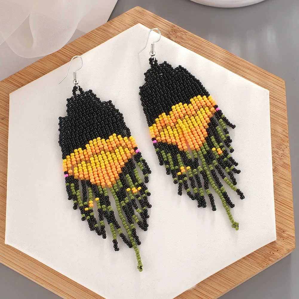 

Rice Bead Earrings Hand weaving Beaded flower Simplicity circular Bohemia geometry alloy ma'am Tassel Earrings