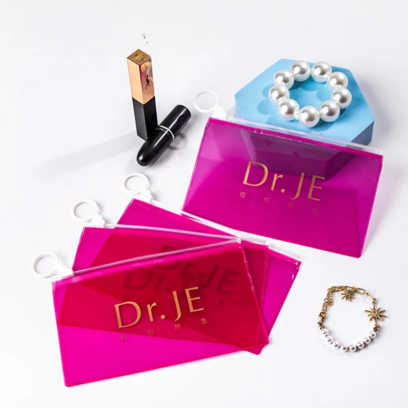 Customized product、OEM custom size gold hot stamping logo pvc poly plastic pink pouch bags with ring zippers for small business
Customized product、OEM custom size gold hot stamping logo pvc poly plastic pink pouch bags with ring zippers for small business