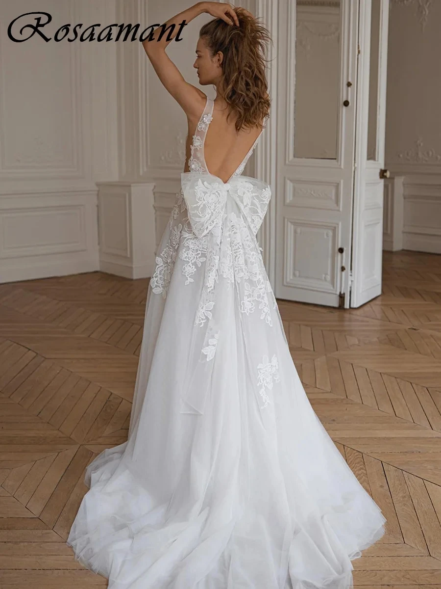 Romantic V-Neck Backless Wedding Dresses A-Line Sleeveless Appliques Lace Bow Bridal Gowns Robe De Mariée
Romantic V-Neck Backless Wedding Dresses A-Line Sleeveless Appliques Lace Bow Bridal Gowns Robe De Mariée