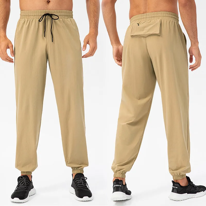 

2024 Men's Trousers Spring Summer New Elasticity Solid Color Fashion Pocket Drawstring Full Length Casual Sports Pants Pantalon