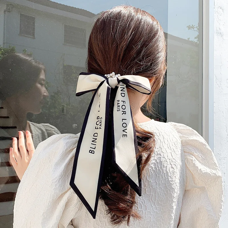Girl Imitation Pearl Streamer Hair Rope Silk Scarf Headband New Simple Bow Headdress Hair Tie for Women Fashion Hair Accessories
Girl Imitation Pearl Streamer Hair Rope Silk Scarf Headband New Simple Bow Headdress Hair Tie for Women Fashion Hair Accessories