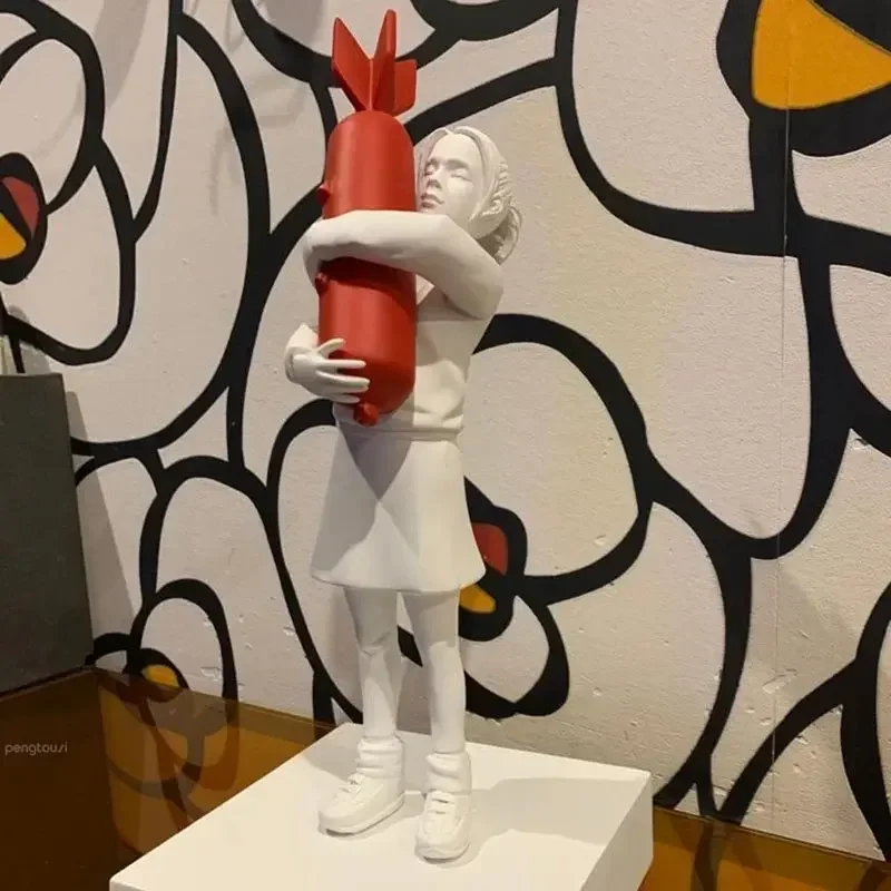 Bomb Hugger Banksy Sculpture Bomb Girl Street Art Resin Statue Design Ornaments Office Home Decor Living Room Decoration Crafts
Bomb Hugger Banksy Sculpture Bomb Girl Street Art Resin Statue Design Ornaments Office Home Decor Living Room Decoration Crafts