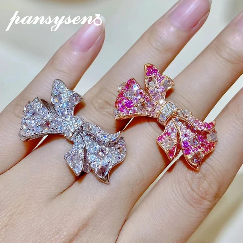PANSYSEN Luxury Solid 925 Sterling Silver Bow-knot Pink Sapphire High Carbon Diamond Gemstone Open Rings for Women Wedding Gifts
PANSYSEN Luxury Solid 925 Sterling Silver Bow-knot Pink Sapphire High Carbon Diamond Gemstone Open Rings for Women Wedding Gifts