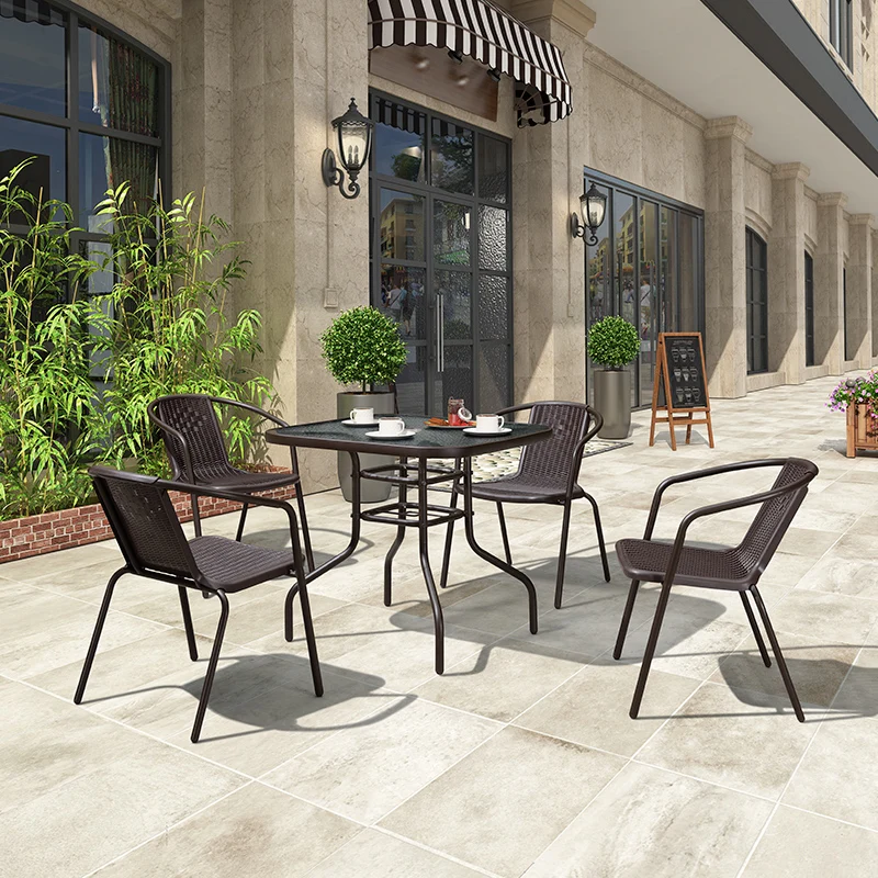 

Purple Leaf Garden tables and chairs three or five sets of imitation rattan chairs with umbrellas outside the courtyard