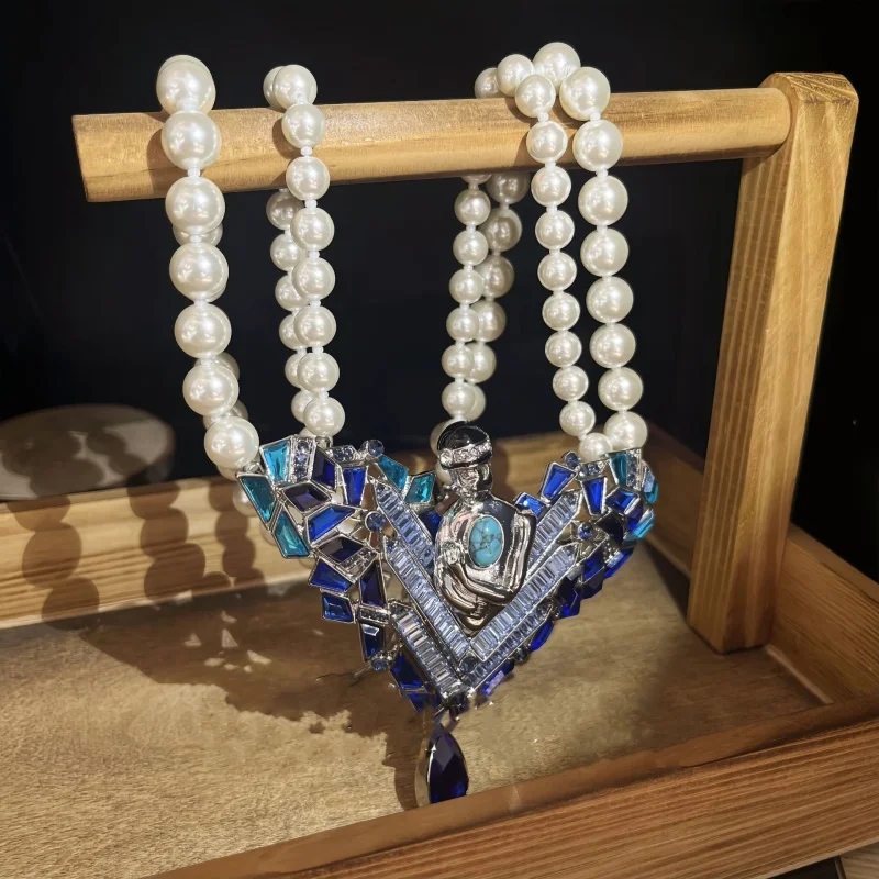 French vintage heart-shaped pendant necklace exudes an elegant charm. It is adorned with rhinestone and pearl chains 4 Mallzona S9decd06a85ee49f9b7a125525d699e07K French vintage heart-shaped pendant necklace exudes an elegant charm. It is adorned with rhinestone and pearl chains Mallzona