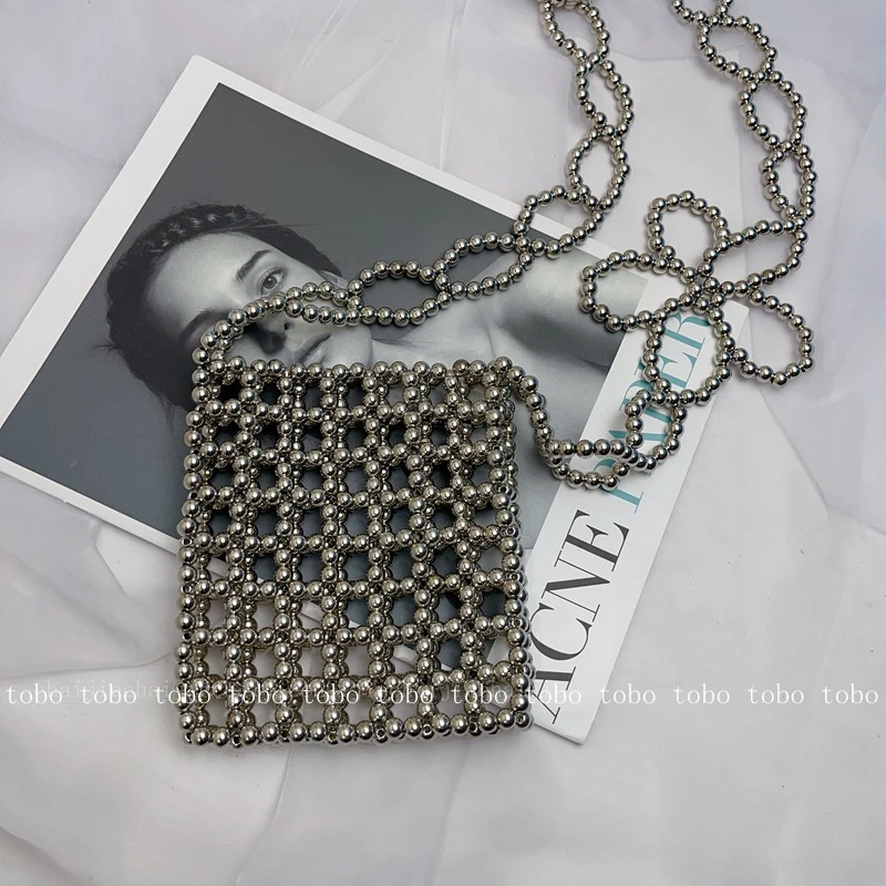 INS Hot Sale Handmade Hollow Out Summer Beach Designer Ladies Wallets Silver Beaded Woven Flower Chain Crossbody Bags for Women
INS Hot Sale Handmade Hollow Out Summer Beach Designer Ladies Wallets Silver Beaded Woven Flower Chain Crossbody Bags for Women