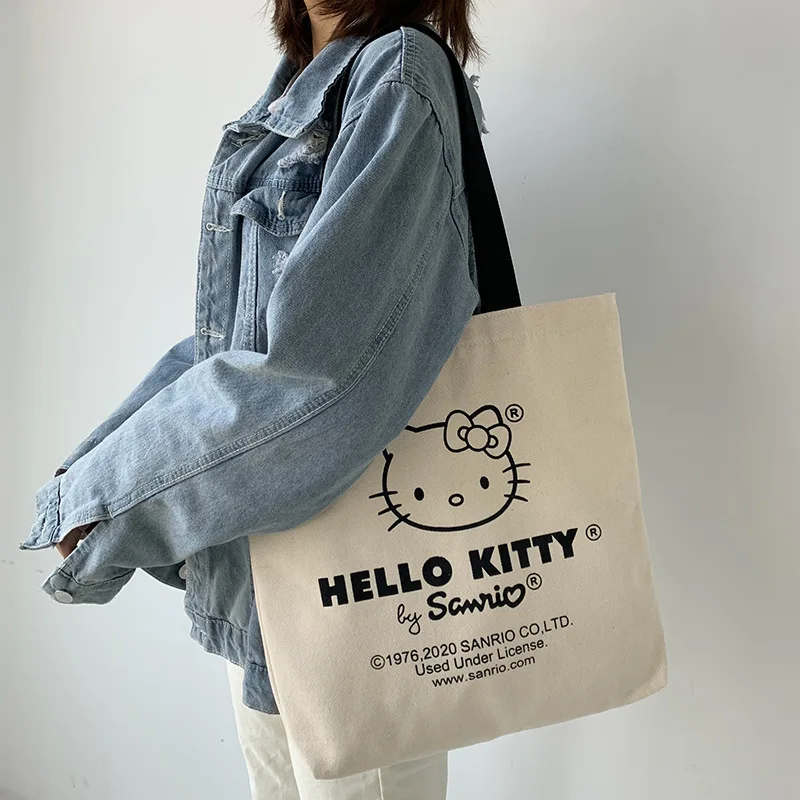 Холщовая Сумка Sanrio Hello Kitty для девочек, повседневная вместительная аниме сумка на плечо, выходная тканевая сумка для покупок
Холщовая Сумка Sanrio Hello Kitty для девочек, повседневная вместительная аниме сумка на плечо, выходная тканевая сумка для покупок