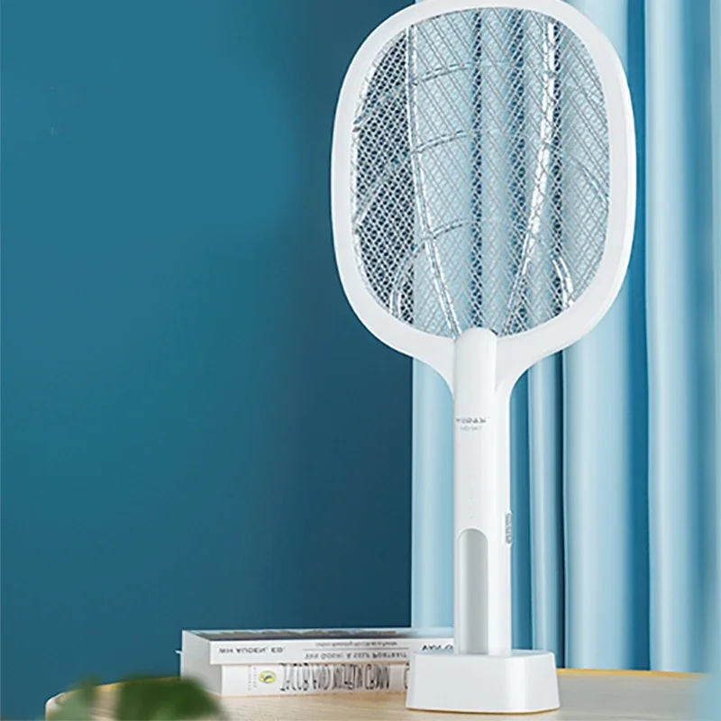Tennis racket type electric mosquito swatter, purple light mosquito, with charging base that is put on the charging
Tennis racket type electric mosquito swatter, purple light mosquito, with charging base that is put on the charging