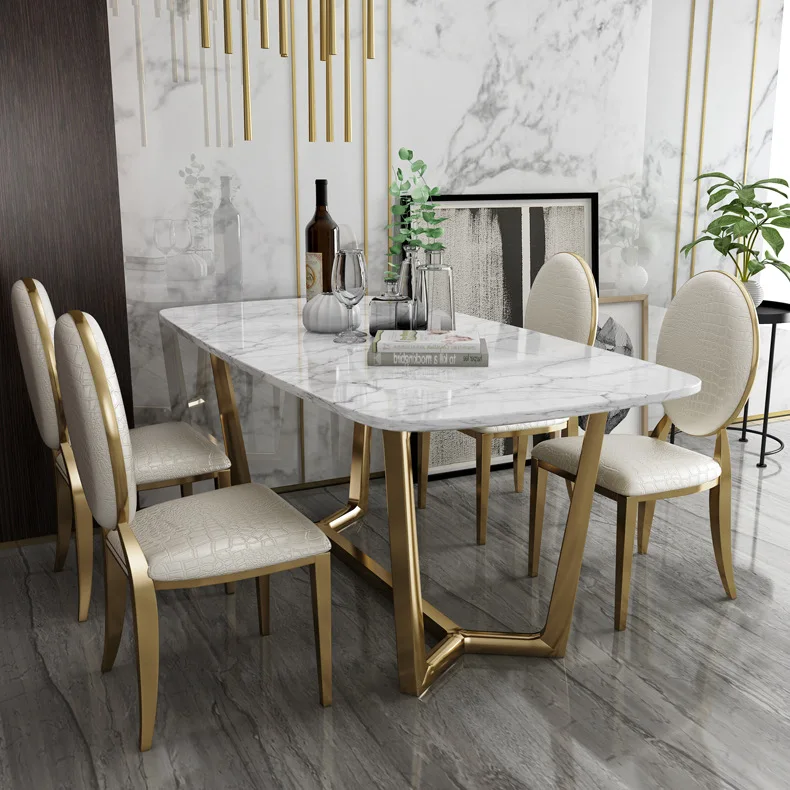 Light luxury dining table and chair set small apartment postmodern creative stainless steel marble dining table Nordic home dini
Light luxury dining table and chair set small apartment postmodern creative stainless steel marble dining table Nordic home dini