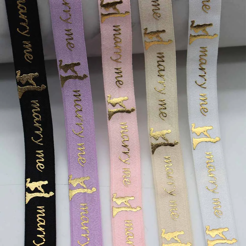 5/8" 15MM Gold Foil Marry Me Printed Fold Over Elastic FOE Ribbon For Valentine's Day Decoration DIY Knot Ties Hair Accessories
5/8" 15MM Gold Foil Marry Me Printed Fold Over Elastic FOE Ribbon For Valentine's Day Decoration DIY Knot Ties Hair Accessories