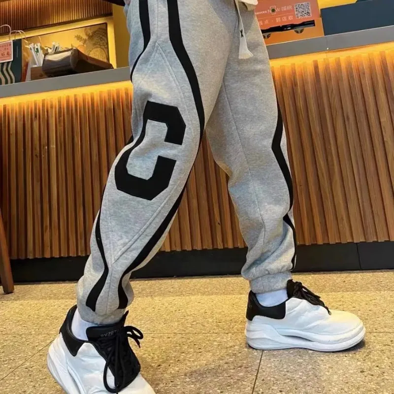 Autumn Winter Men Striped Lettering Fashion Sweatpants Casual Jogger Pants Men's Harem Trousers High Quality Designer Clothing
Autumn Winter Men Striped Lettering Fashion Sweatpants Casual Jogger Pants Men's Harem Trousers High Quality Designer Clothing