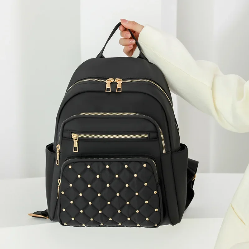 Solid Color Diamond Earrings Fashion Backpack Female Texture Korean Version of Large Capacity Simple Women's Backpack.
Solid Color Diamond Earrings Fashion Backpack Female Texture Korean Version of Large Capacity Simple Women's Backpack.