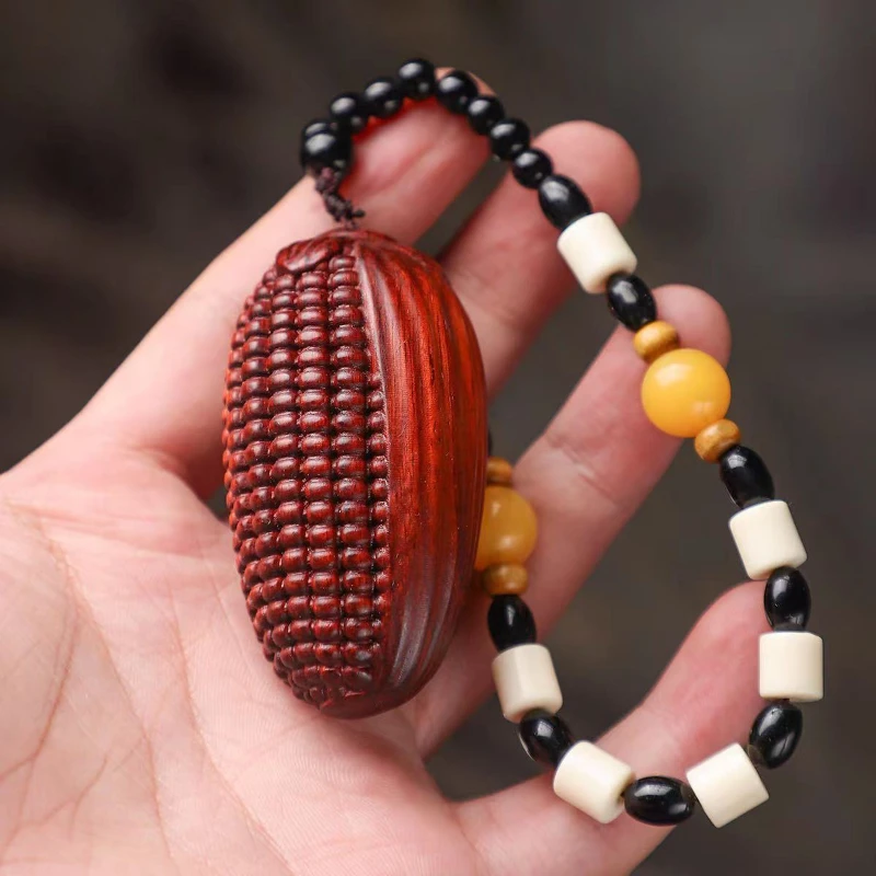 

Red sandalwood carving, full of gold and jade, with handlebars for cars, hanging pieces, solid wood, corn, and playing objects