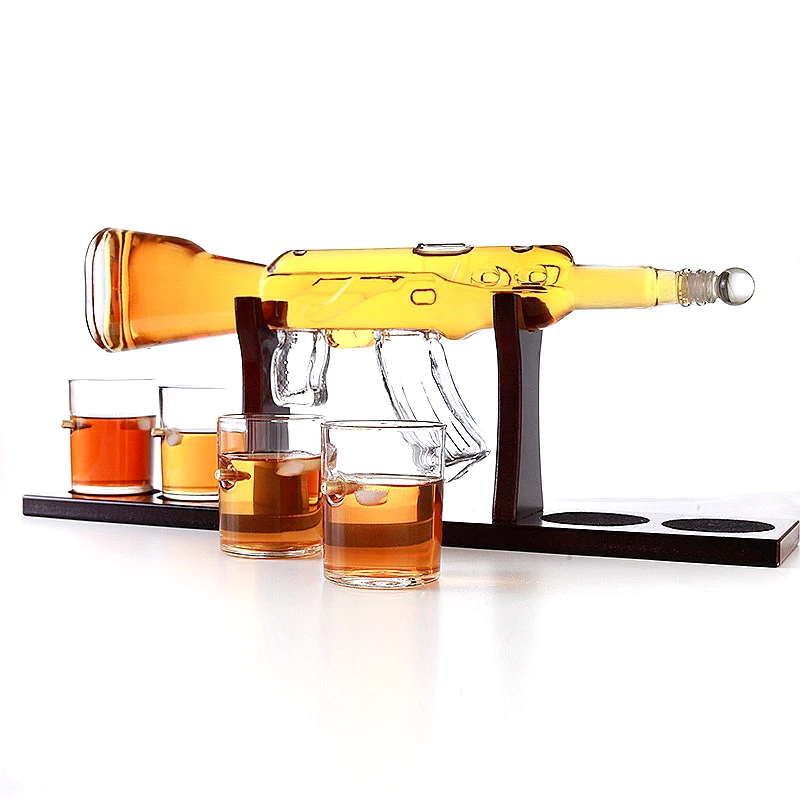 Gun Shape Whisky Glass Wine Container Glass Decanter Set Drinking Vessel Wine Container With 4 Cups 1 Pine Wood Support 
Gun Shape Whisky Glass Wine Container Glass Decanter Set Drinking Vessel Wine Container With 4 Cups 1 Pine Wood Support