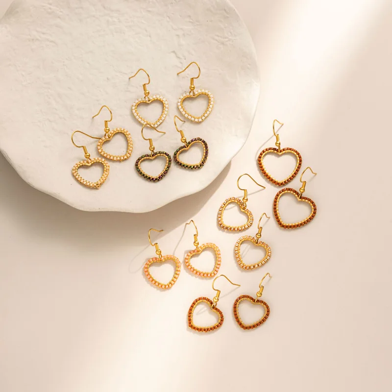 Beaded earrings Heart-shaped Originality Hollow out Geometry Hand knitting Bohemia Alloy Tide Simple Rice bead earrings
Beaded earrings Heart-shaped Originality Hollow out Geometry Hand knitting Bohemia Alloy Tide Simple Rice bead earrings