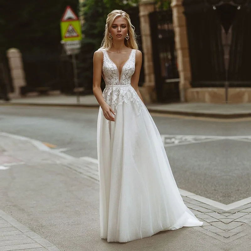 2023 Simple V-neck Top Lace Applique Beach Wedding Dresses Pearl Sashes A-line Tulle Outdoor Backless Bride Dress
2023 Simple V-neck Top Lace Applique Beach Wedding Dresses Pearl Sashes A-line Tulle Outdoor Backless Bride Dress