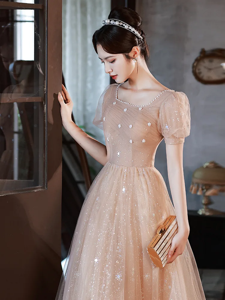 Champagne Tulle Evening Dress Women Square Neck Pearl Applique Sequins Cocktail Dresses Elegant Modern Bubble Sleeve Prom Gown
Champagne Tulle Evening Dress Women Square Neck Pearl Applique Sequins Cocktail Dresses Elegant Modern Bubble Sleeve Prom Gown