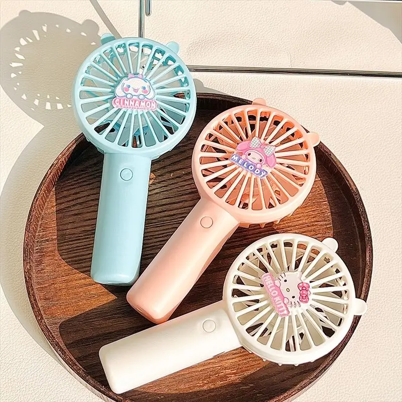 Sanrio Cinnamoroll My Melody Anime Kawaii Charging Portable Mini Handheld Fan Cute Kuromi Cartoon Silent Wind Fan Gifts Toys
Sanrio Cinnamoroll My Melody Anime Kawaii Charging Portable Mini Handheld Fan Cute Kuromi Cartoon Silent Wind Fan Gifts Toys