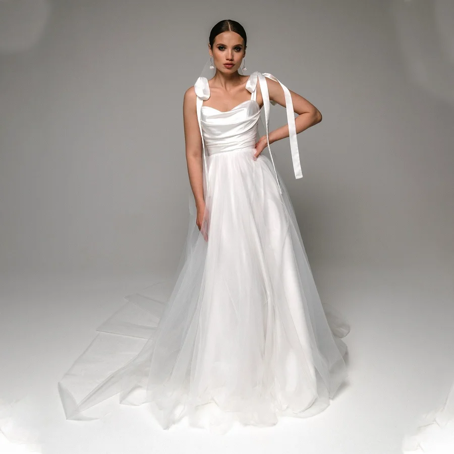 Очаровательное Плиссированное атласное свадебное платье с бантом на бретельках и тюлевым шлейфом со шлейфом, женское изящное свадебное платье со шнуровкой сзади
Очаровательное Плиссированное атласное свадебное платье с бантом на бретельках и тюлевым шлейфом со шлейфом, женское изящное свадебное платье со шнуровкой сзади