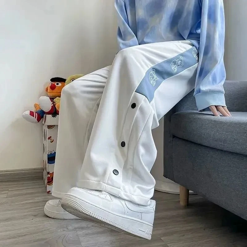 Women Pants Summer Fashion Patchwork High Street Causal Wide-Legged Trousers Side Buttons Bear Harem Pants Chic Design
Women Pants Summer Fashion Patchwork High Street Causal Wide-Legged Trousers Side Buttons Bear Harem Pants Chic Design