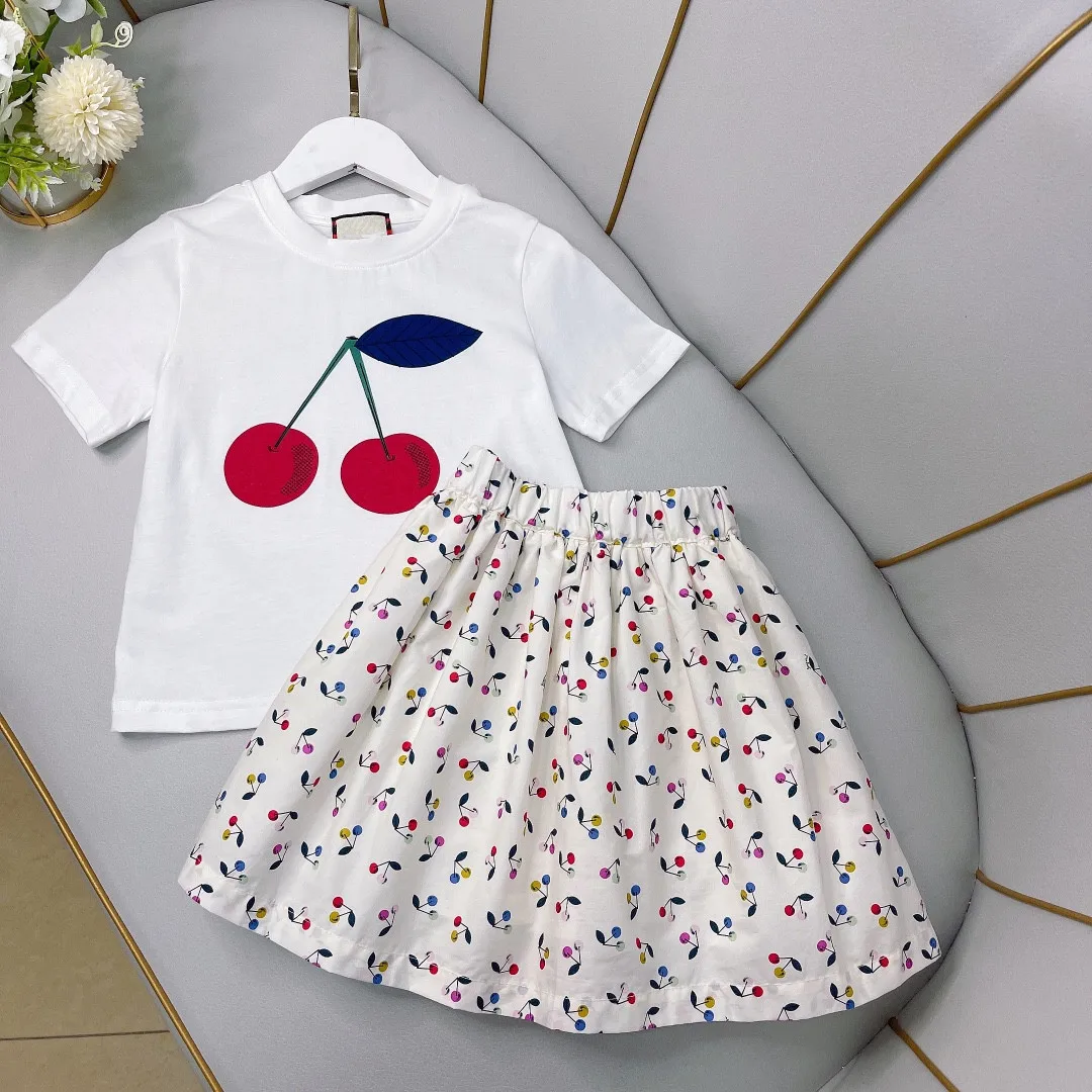 Brand Summer Girls Clothing Sets Cotton Cartoon Cherry T-Shirt+ Skirts 2Pcs Suit Children Fashion Princess Kids Designer Outfits
Brand Summer Girls Clothing Sets Cotton Cartoon Cherry T-Shirt+ Skirts 2Pcs Suit Children Fashion Princess Kids Designer Outfits